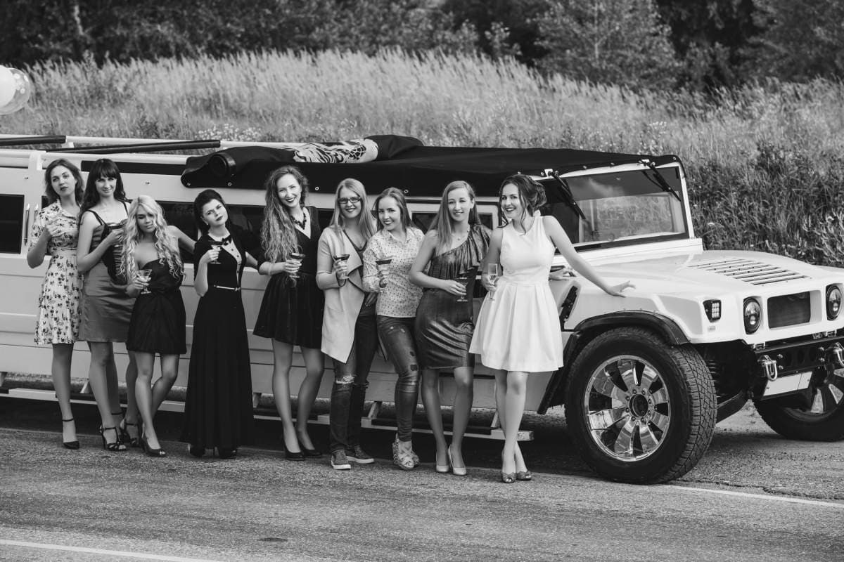 young beautiful happy women celebrate bachelorette party convertible limousine
